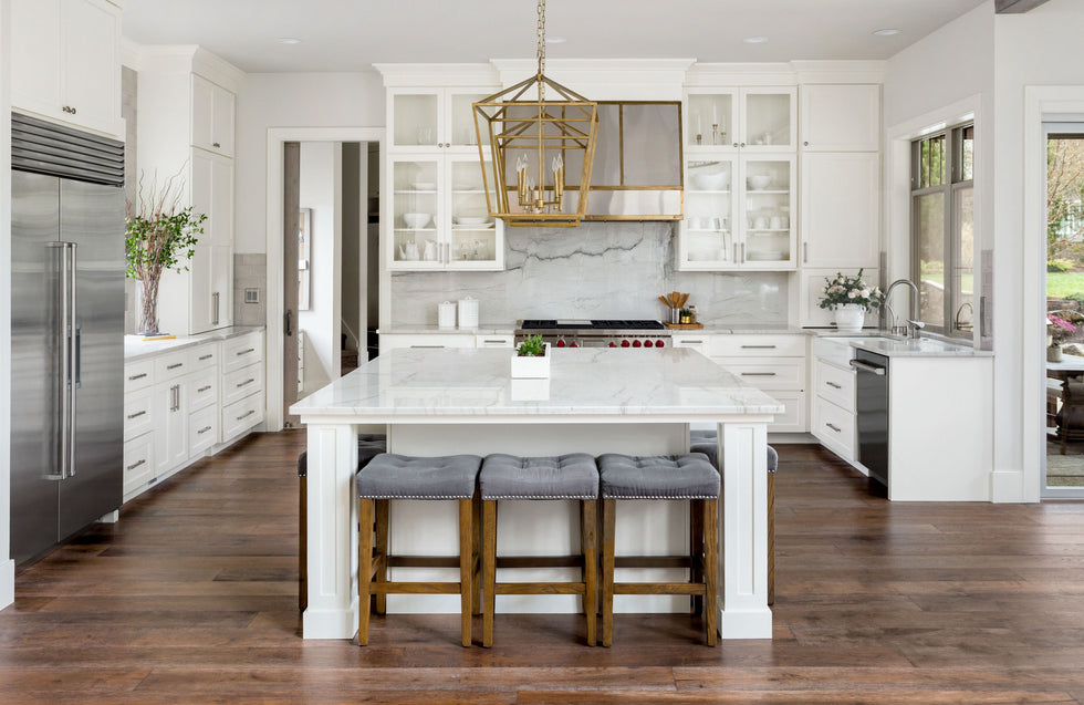 Luxurious white kitchen with stainless appliances