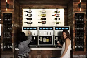 Napa Technology WineStation Pristine Plus Dual Zone Wine Dispenser MX4-H3D Lifestyle Wine Room Two Girls Pouring Wine